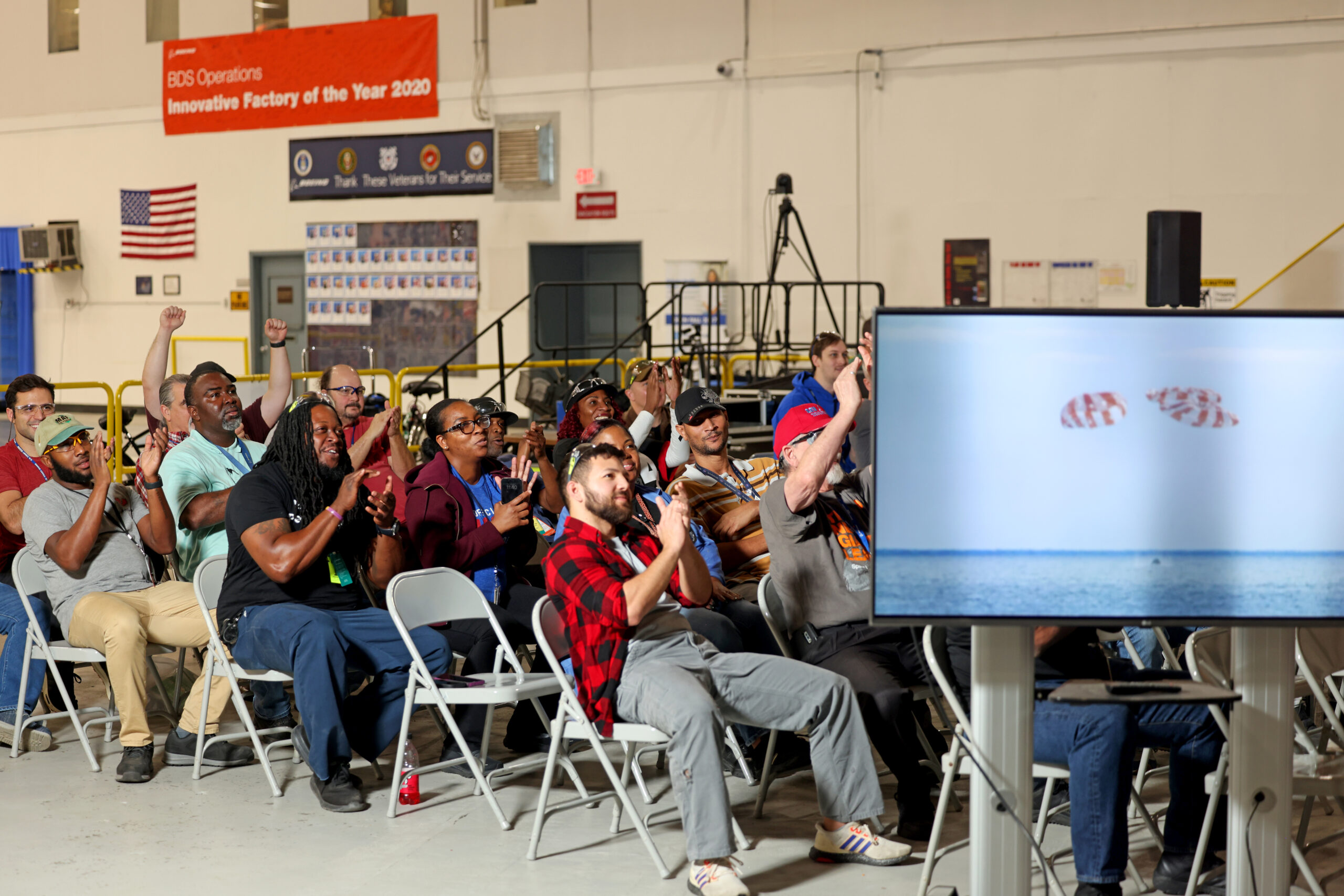Employees at NASA’s Michoud Assembly Facility in New Orleans gather to watch the splashdown of the Orion spacecraft. 